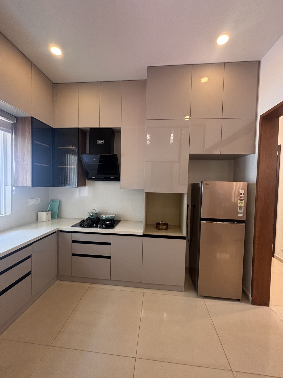 Modular kitchen with LG refrigerator, Wood & Co. Interiors
